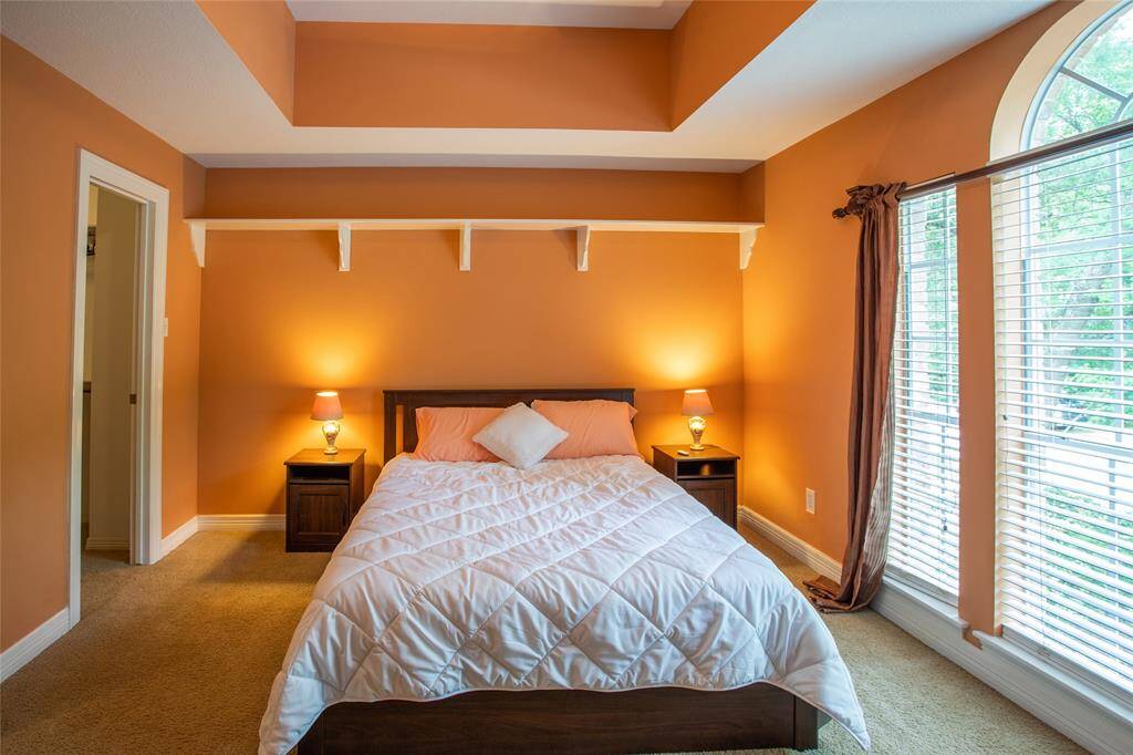 This large upstairs bedroom offers privacy and comfort with its own en-suite bath