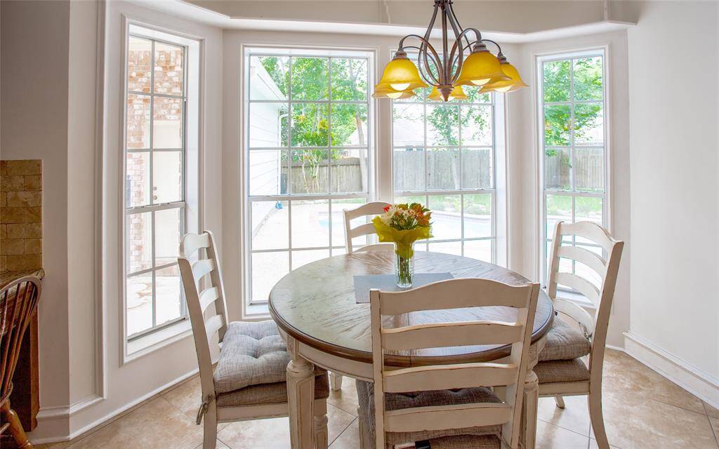 Charming bay window with a serene view of your private pool.