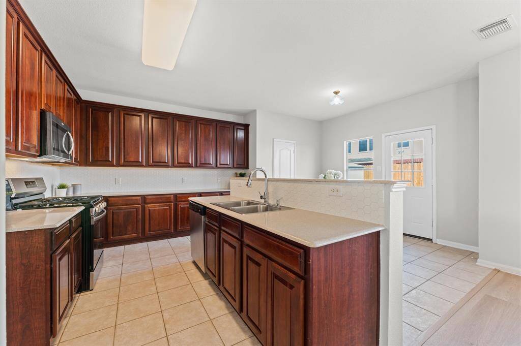 The kitchen is a true centerpiece of the home—bright, spacious, and thoughtfully designed for both everyday meals and special moments.