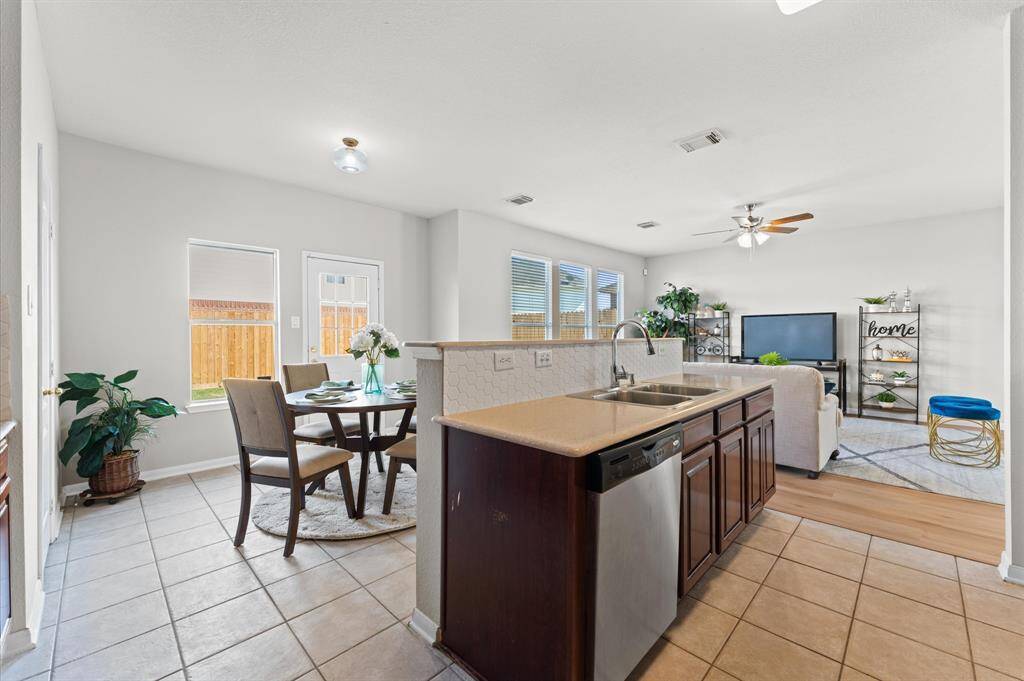 An open view into the living areas keeps you connected with loved ones as you cook.