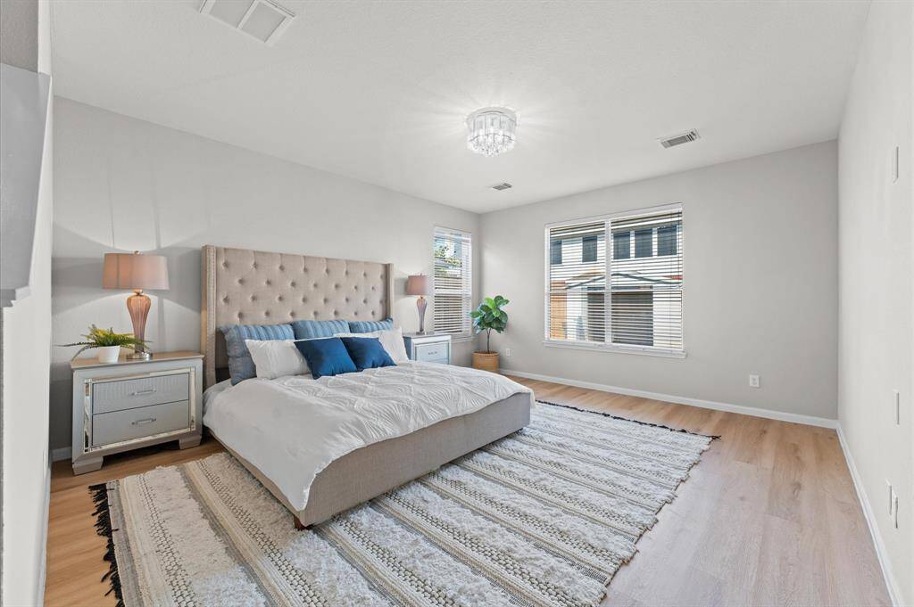 The master suite is your personal retreat, offering the comfort and serenity you deserve. Beautiful large windows fill the room with abundant natural light, creating an airy and open atmosphere.