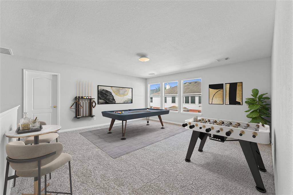 The game room is the ultimate retreat for fun and entertainment, designed to bring everyone together. Its spacious layout makes it perfect for movie nights, board games, or hosting friends for the big game.