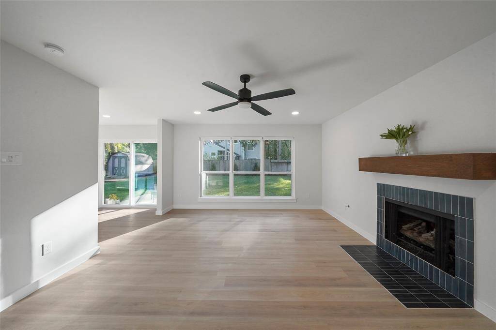 Generously sized family room with gaslog fireplace perfect for gatherings or relaxing at the end of the day.