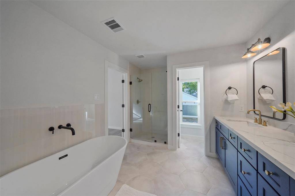 Separate shower and soaking tub.