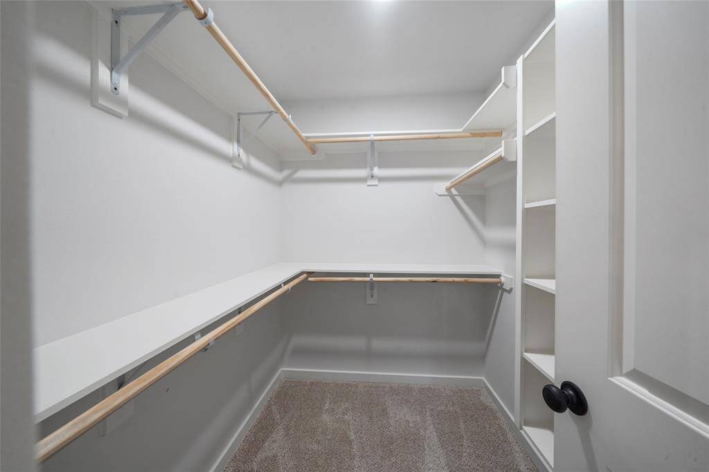 Primary walk-in closet.