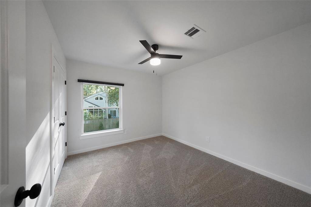 Bedroom #4 with fan and double door closet.