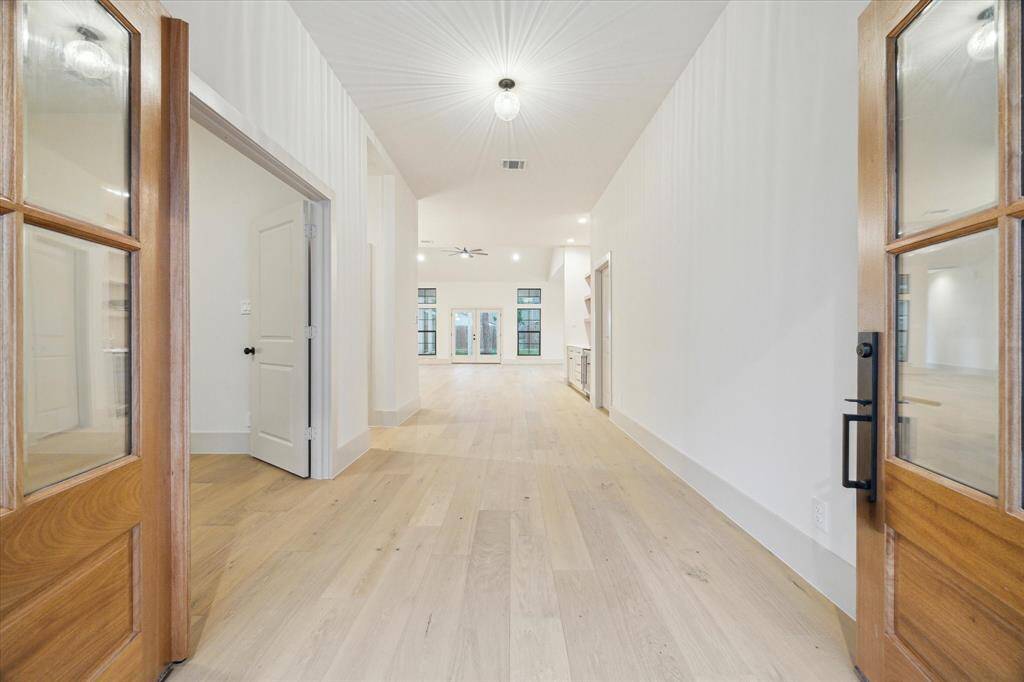 study to the right of entry, large plank winter wood oak floors throughout the home.