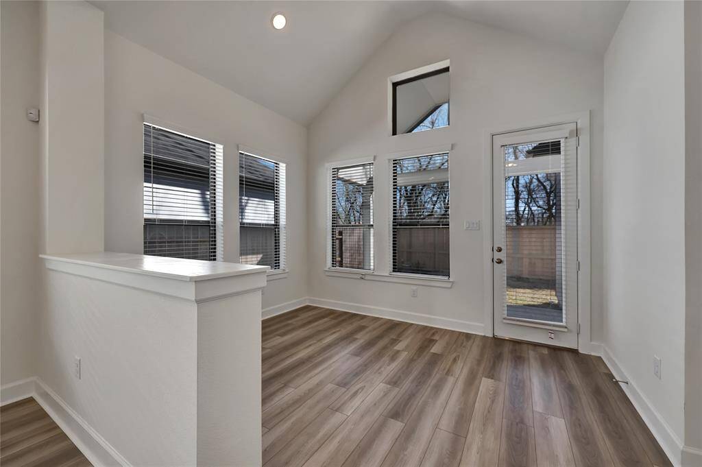 There is convenient and additional access to the backyard and covered back patio.