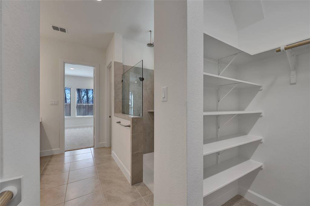 Right off the primary bathroom is the spacious walk-in closet.