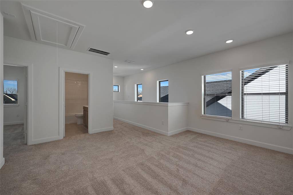 Gigantic Game Room featuringplush carpeting and enormousamounts of natural lighting.