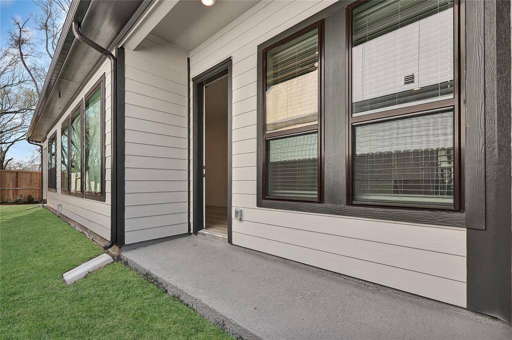The covered patio is perfect for an outdoor sitting area.