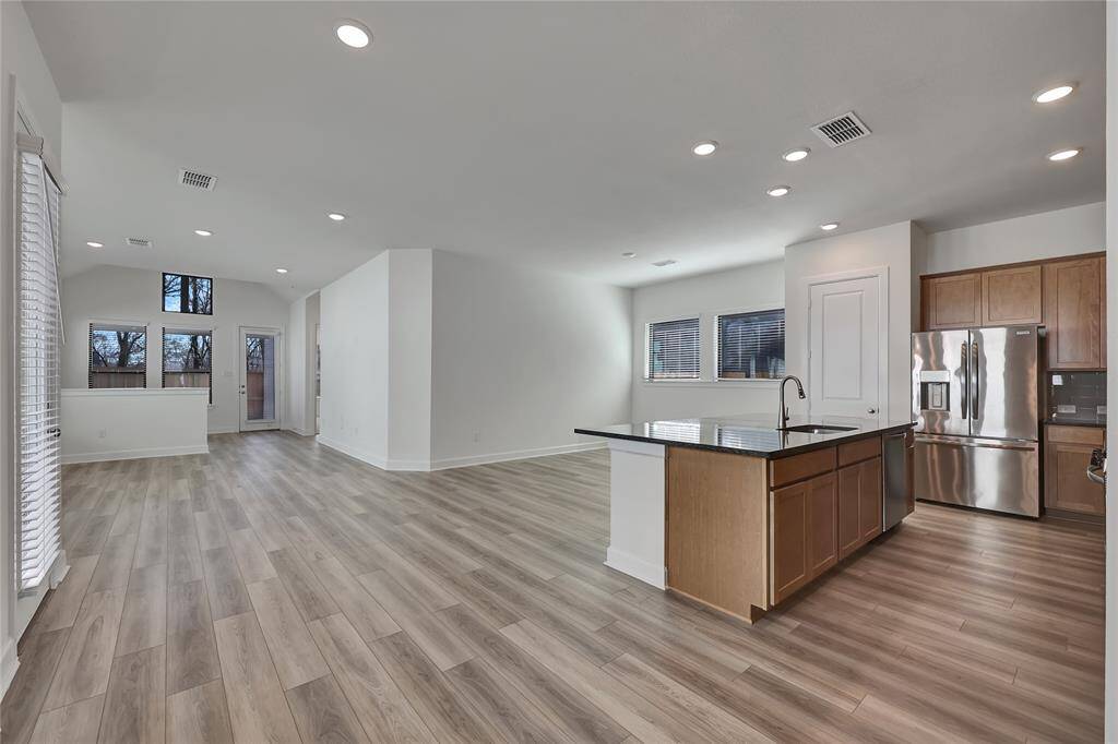 Blissful Breakfast Area thatoffers nice flooring, naturallighting, and easy access to the kitchen.