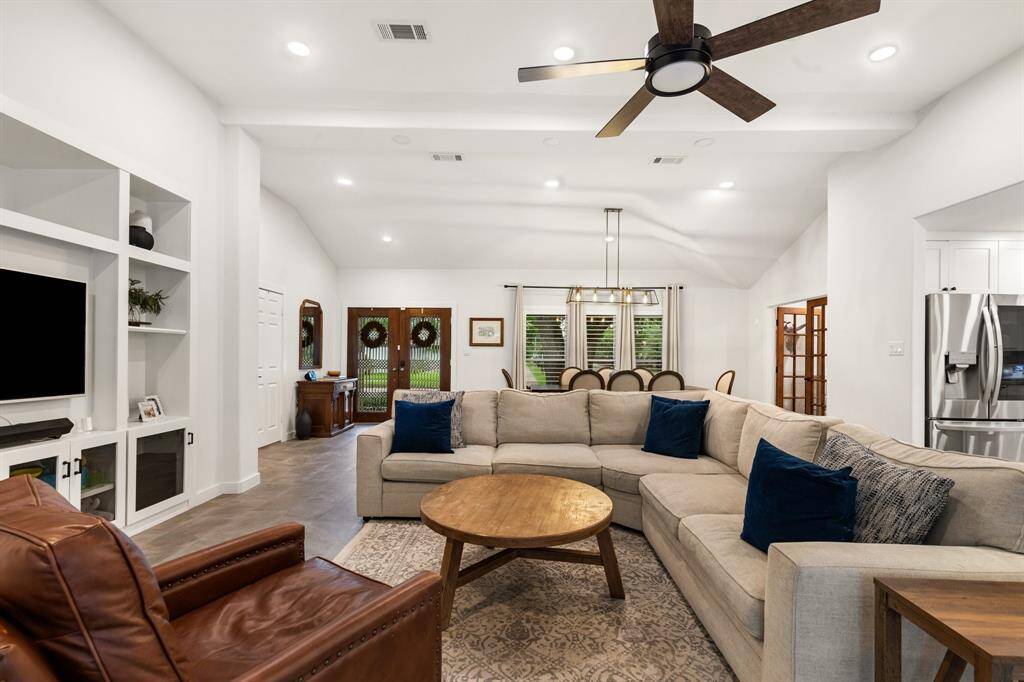 This open layout allows natural light to flow freely throughout the space, making the entire area feel inviting and promotes a welcoming atmosphere.