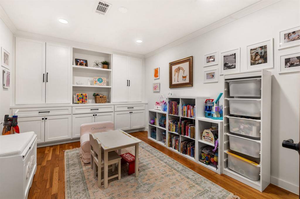 This home office is enhanced with custom cabinetry and makes a great work-from-home space, playroom, or whatever best fits your lifestyle.