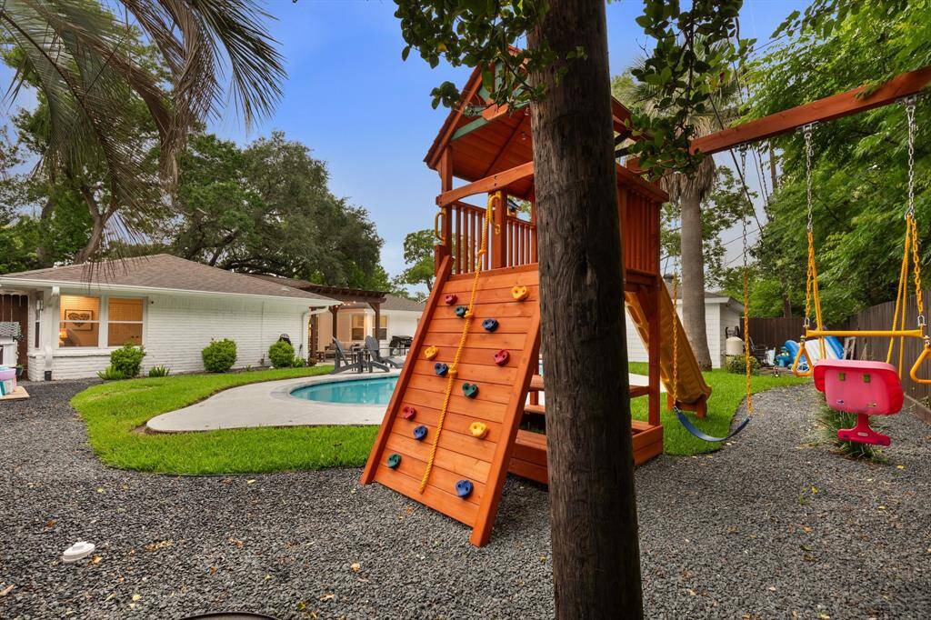 There is plenty of space in the backyard for a play area in addition to the pool.
