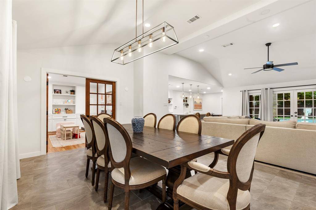 This large formal dining area is complete with modern chandelier, space for a table with 8-10 chairs, views of the open common living areas, and a great environment to spend time with loved ones.