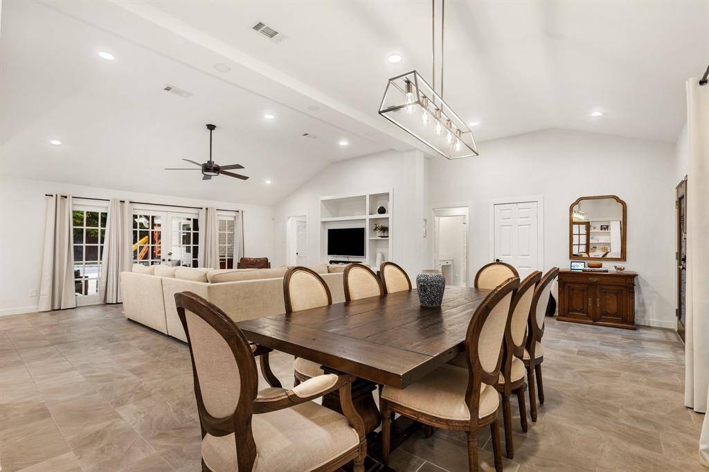 Every inch of this home tells a story of careful curation including this great dining area complete with Ferguson chandelier that sets the tone for elegant entertaining.