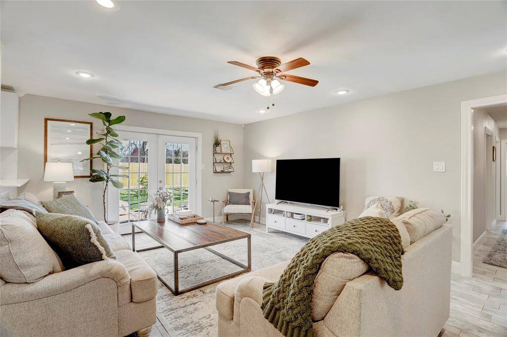 Great open floor plan. view of the living area looking towards the front door and the kitchen pass thru too.