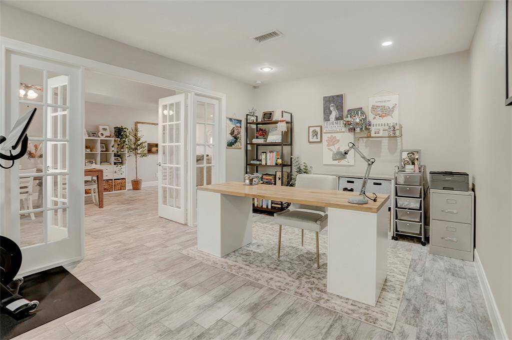 Large home office space with French glass doors that can close off the space. Recessed lights!
