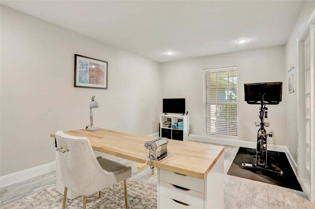Another view of home office bonus room space with recessed lights!