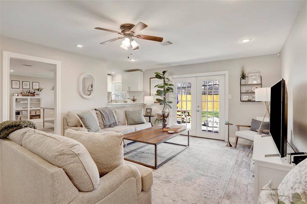 Another view of dining area looking towards the front door and the French doors that are used to close off the home office space.
