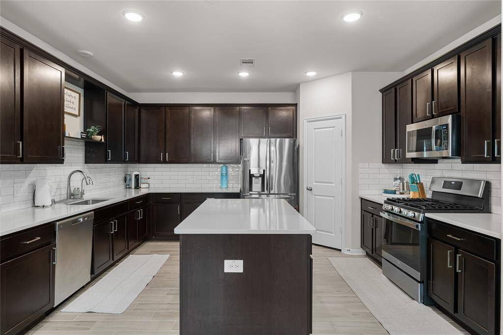 Kitchen with all the cabinet space you could need, even in the island!