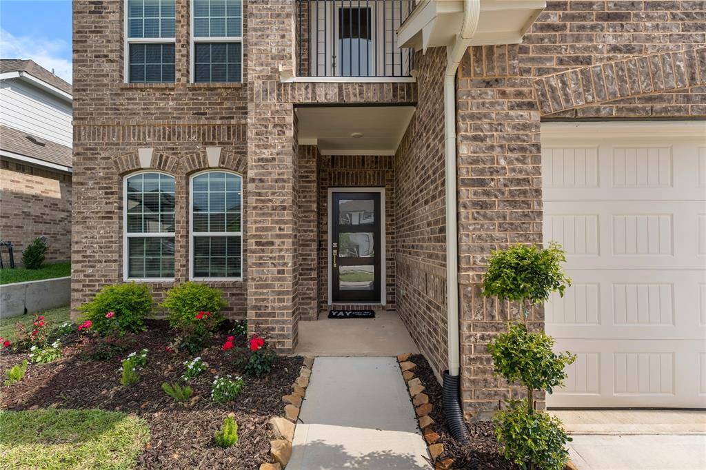 Notice the balcony above the front door