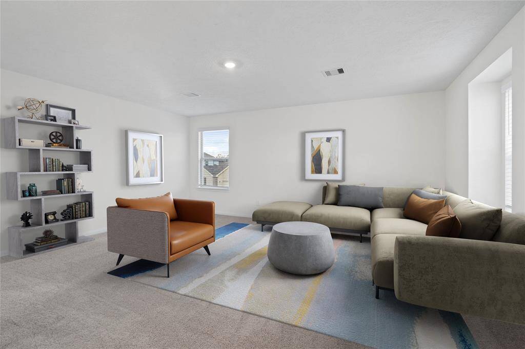 Come upstairs and enjoy a day of leisure in this fabulous loft! This is the perfect hangout spot or adult game room, this space features plush carpet, high ceiling, recessed lighting, large windows with privacy blinds, and custom paint