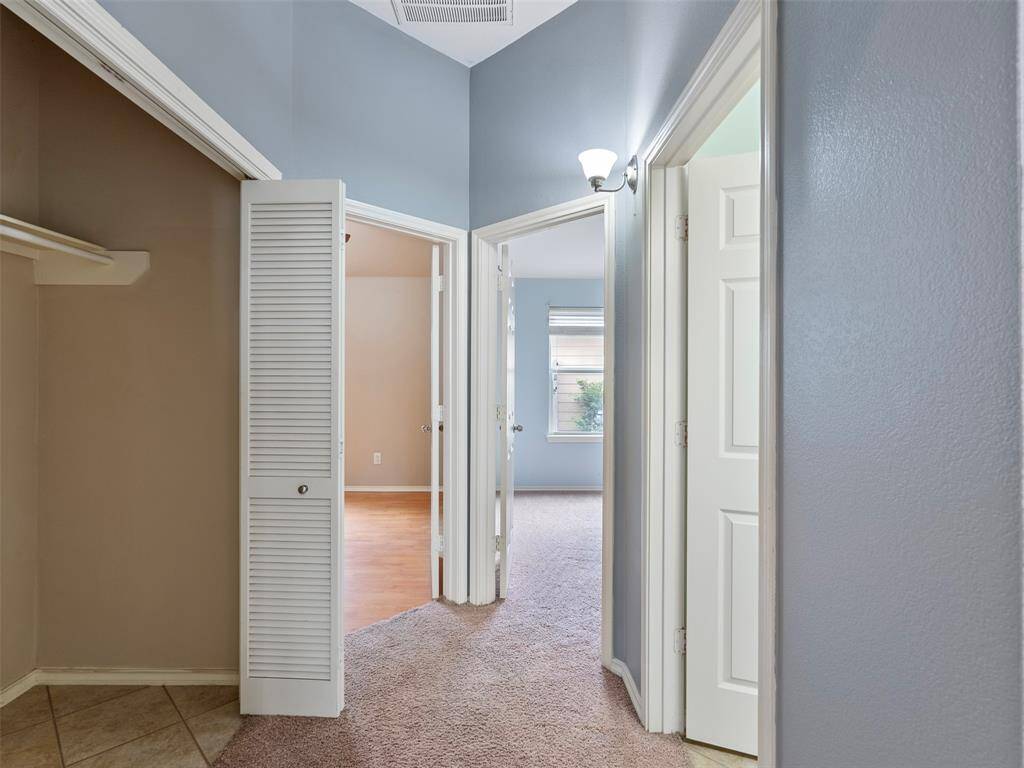 Entry to utility nook and 2 secondary bedrooms