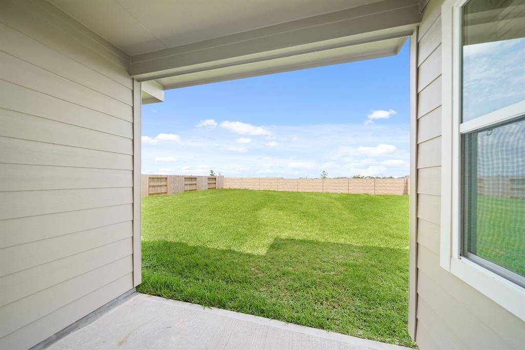 Covered patio overlooking the backyard