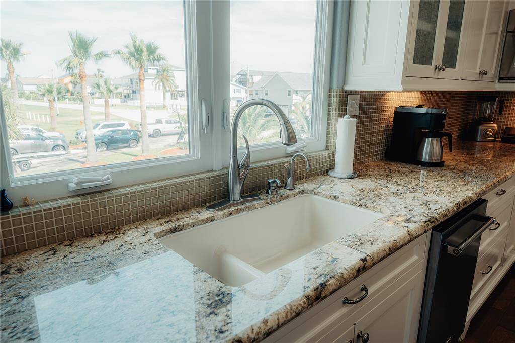 kitchen sink has a perfect window to enjoy another amazing view