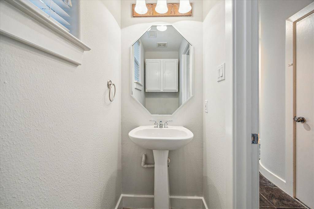 The home has two powder rooms, this one on the first floor next to the study or what could be the 3rd bedroom.