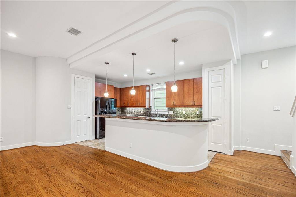 The kitchen has two pantries and an abundance of counter space for cooking and plenty of cabinetry for storage.