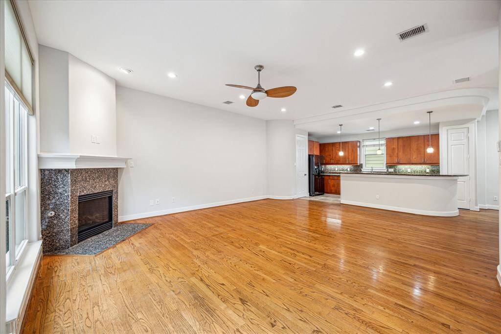Recessed lighting and an attractive ceiling fan.
