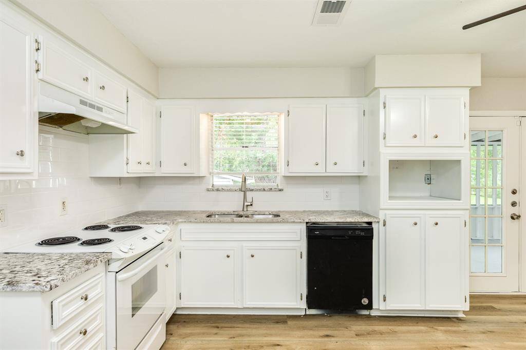 Tons of wood cabinets for added storage.