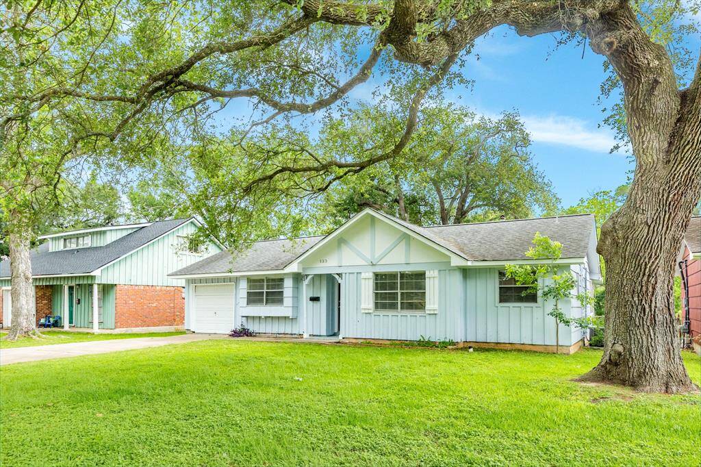 Large front yard with a true one car garage perfect for smaller vehicles or extra storage space.
