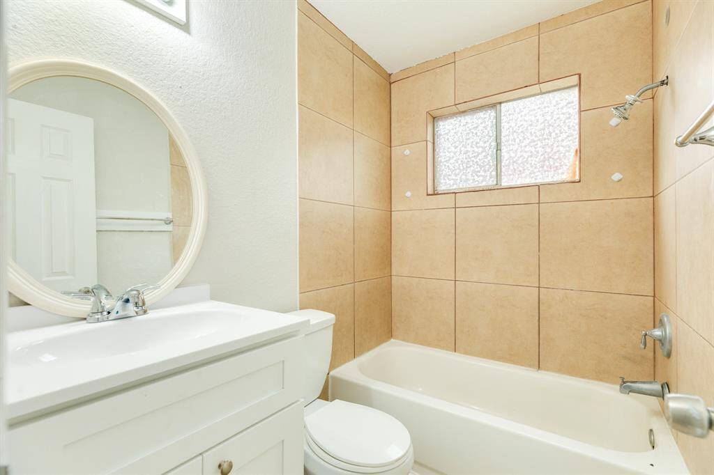 Full bath with shower tub combo.