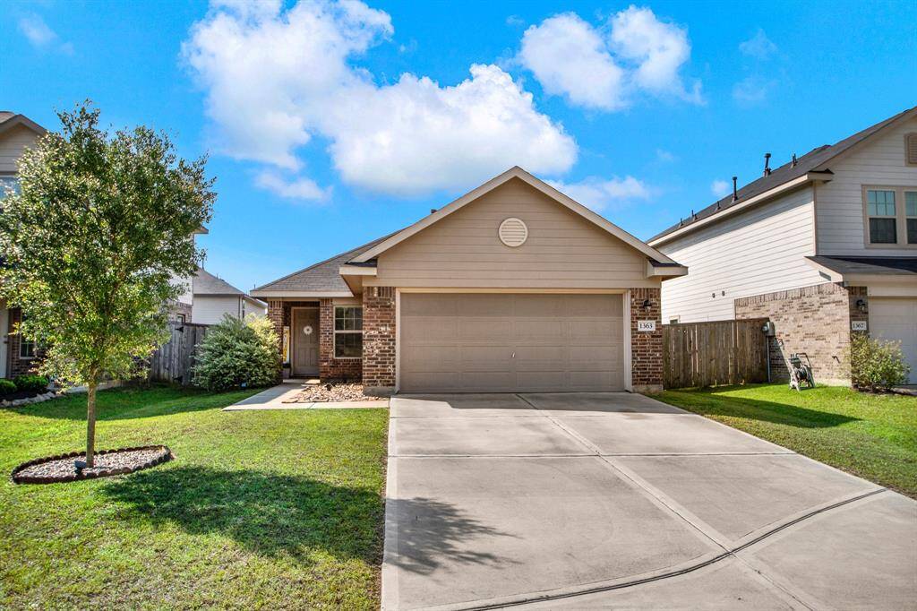 Charming single-story home with a brick facade and attached two-car garage. The front yard is well-maintained with a sidewalk and shrubs leading to the front door. Ideal for comfortable living in a friendly neighborhood.