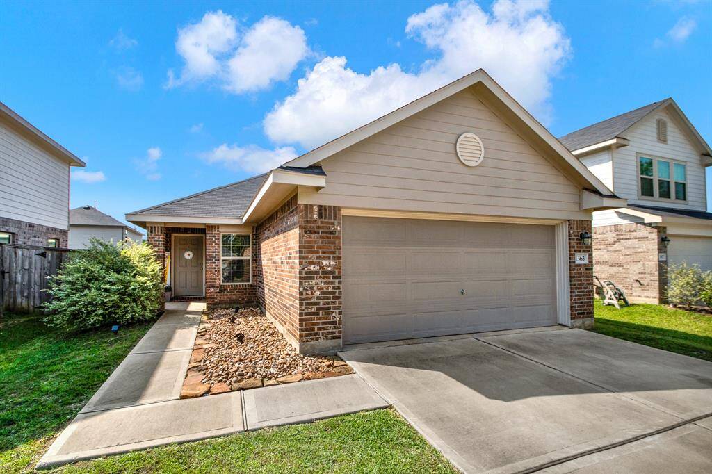 Charming single-story home with a brick facade and attached two-car garage. The front yard is well-maintained with a sidewalk and shrubs leading to the front door. Ideal for comfortable living in a friendly neighborhood.