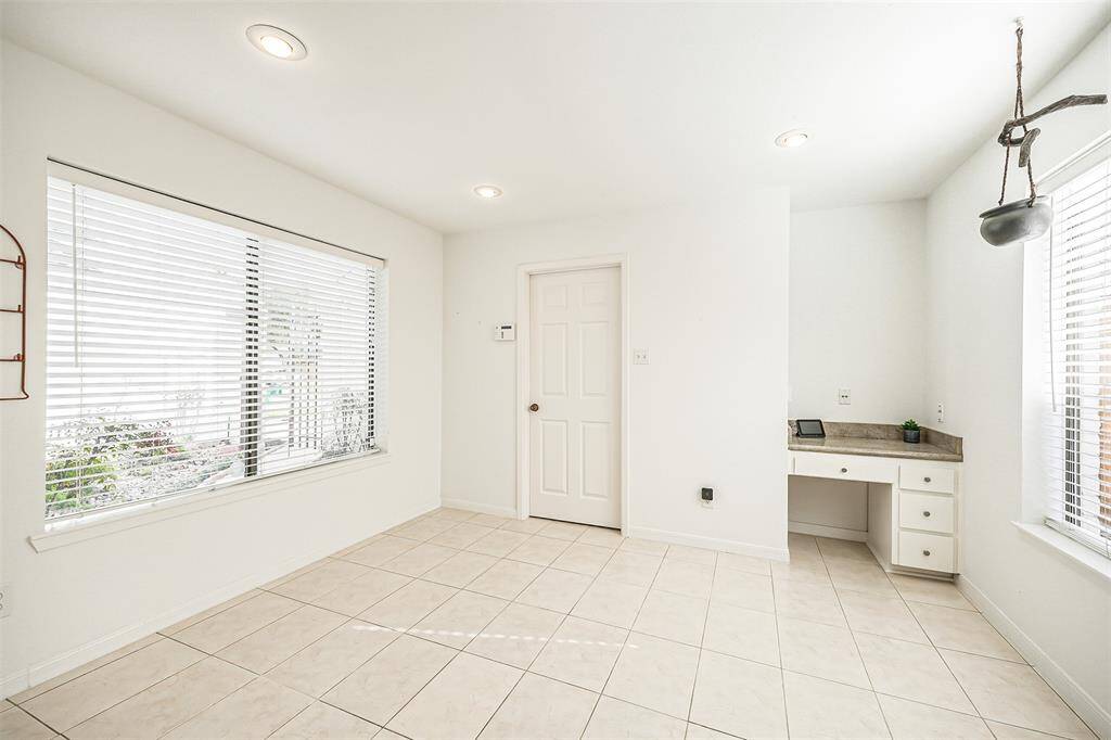 Breakfast area to enjoy meals together with wall of windows and an abundance of natural lighting