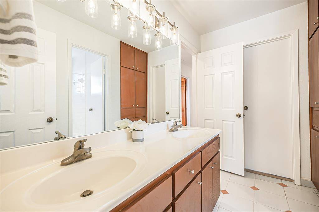 Full Bathroom with extended mirror, upgraded fixtures and tile flooring adding to the elgance from entry to exit