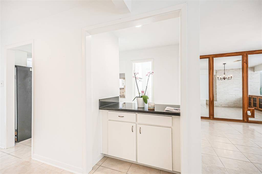 Open Access with additional cabinetry, granite countertops and access to mutliple areas for ease when hosting guests.