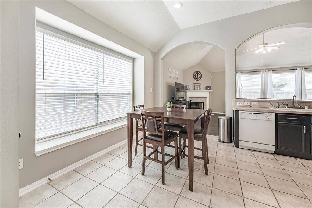 From Wednesday night lasagna to Saturday morning pancakes, you’ll love gathering in this charming breakfast area featuring tile flooring and amazing natural light.