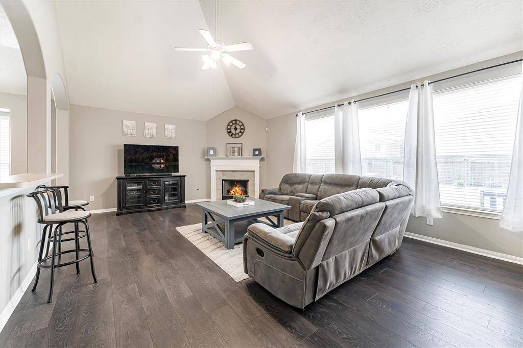 Cozy up by the gas-log fireplace with a good book and your favorite beverage—this warm and welcoming family room is made for relaxing evenings and quiet moments at home.