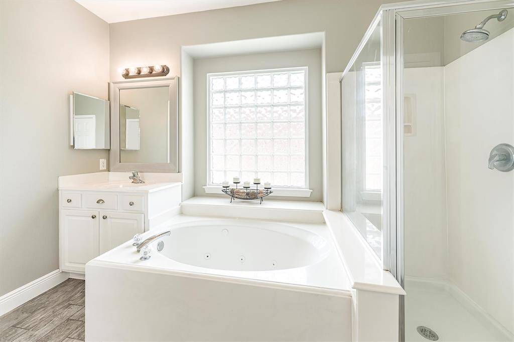 Relax and soak your worries away in this luxurious jetted tub or enjoy a quick rinse in the spacious walk-in shower. Either way, you'll love this private retreat.