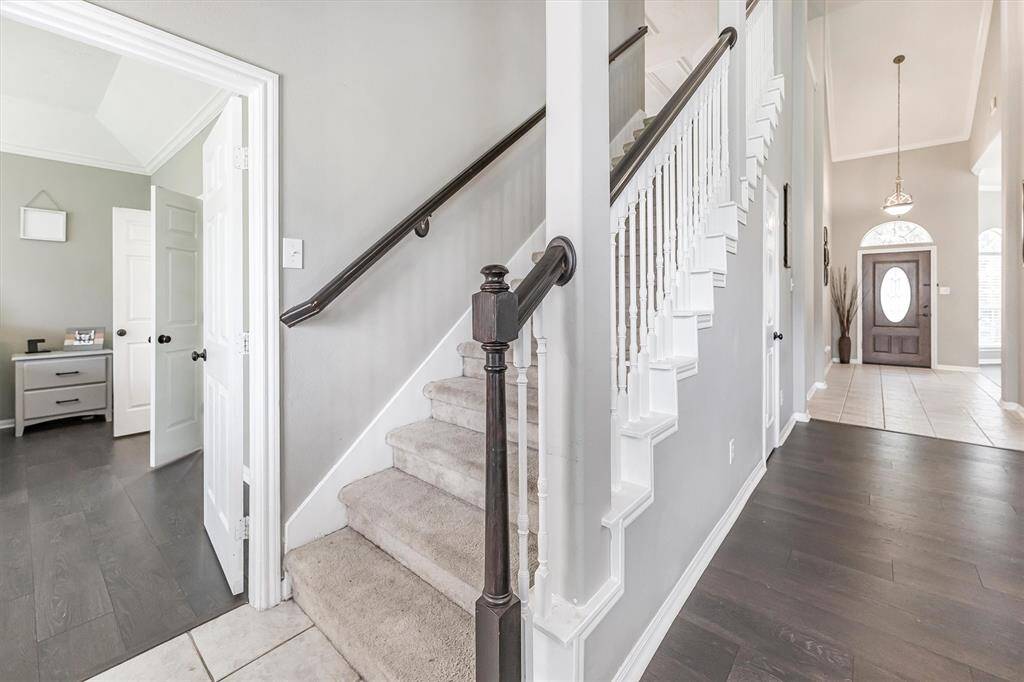 This modern floor plan features open-concept living, dining, kitchen, and the primary suite all on the main floor, with a game room, two secondary bedrooms, and a full bath tucked upstairs. Let’s head up and take a look!