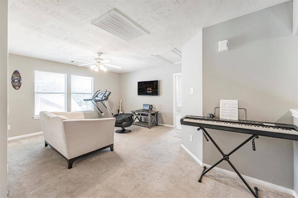 It’s all fun and games in this super-sized upstairs game room—perfect for movie nights, board game battles, and summer slumber parties!