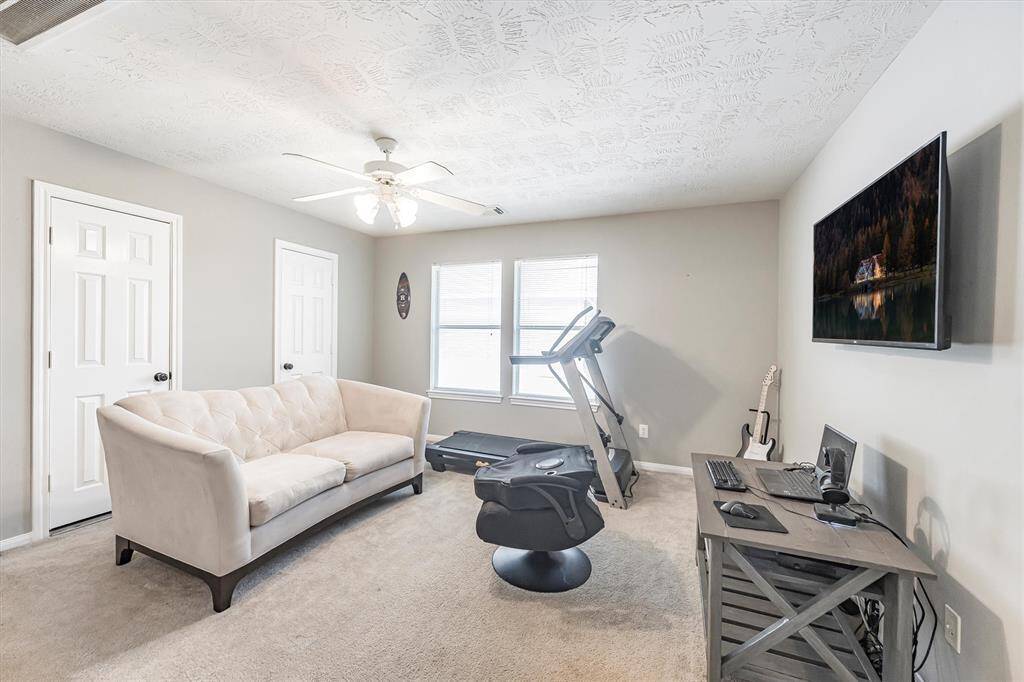 Take another peek at your new game room complete with neutral paint, plush carpet, oversized windows, and plenty of space for a game table, big screen, and all your favorite ways to unwind.