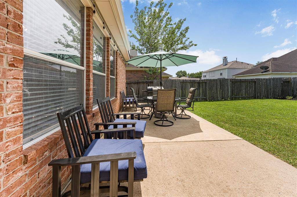 Enjoy summer BBQs and back yard birthday parties with help of this expansive patio with plenty of room for your grill and seating for friends and family.