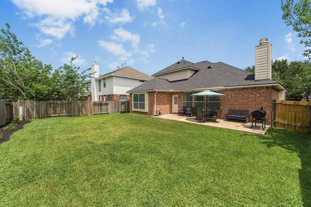Whether you're hosting lively gatherings or seeking tranquility after a long day, this back yard paradise with a large patio promises to provide the perfect space where memories are made and stress melts away.